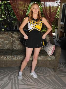 Strawberry blonde cheerleader Indiana Jane strips naked. — photo 1 of 15