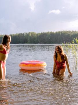 Margo Von Teese and Simona splash each other in their bikinis in a lake before eating each other out on the beach.  — photo 1 of 16