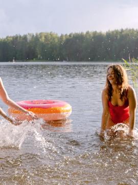 Margo Von Teese and Simona splash each other in their bikinis in a lake before eating each other out on the beach.  — photo 2 of 16