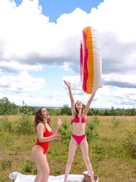 Margo Von Teese and Simona splash each other in their bikinis in a lake before eating each other out on the beach.  — photo 9 of 16