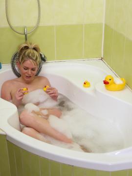 Wet teen plays with her dildo in bath — photo 2 of 24