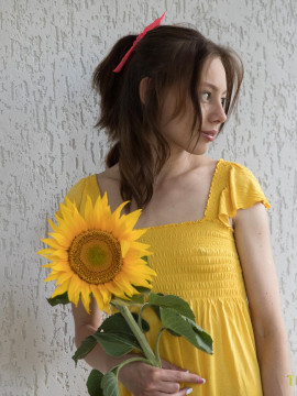 Sweetie plays with sunflower and dildo — photo 1 of 16