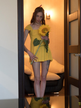 Sweetie plays with sunflower and dildo — photo 2 of 16
