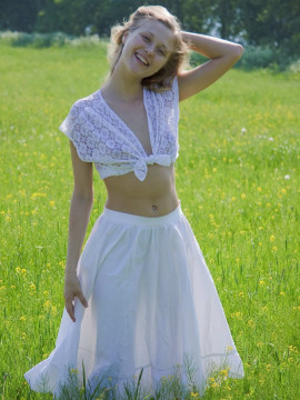 Teen masturbating on the grass — photo 1 of 15
