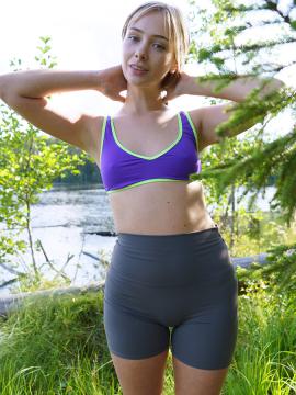 Outdoorsy blonde with cute, perky tits drops her yoga pants and spreads her pussy next to a lake. — photo 4 of 16